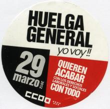 This circular sticker is blocked off into three different sections of white, red and black advertising a general strike held in Spain on March 29th, 2012. 